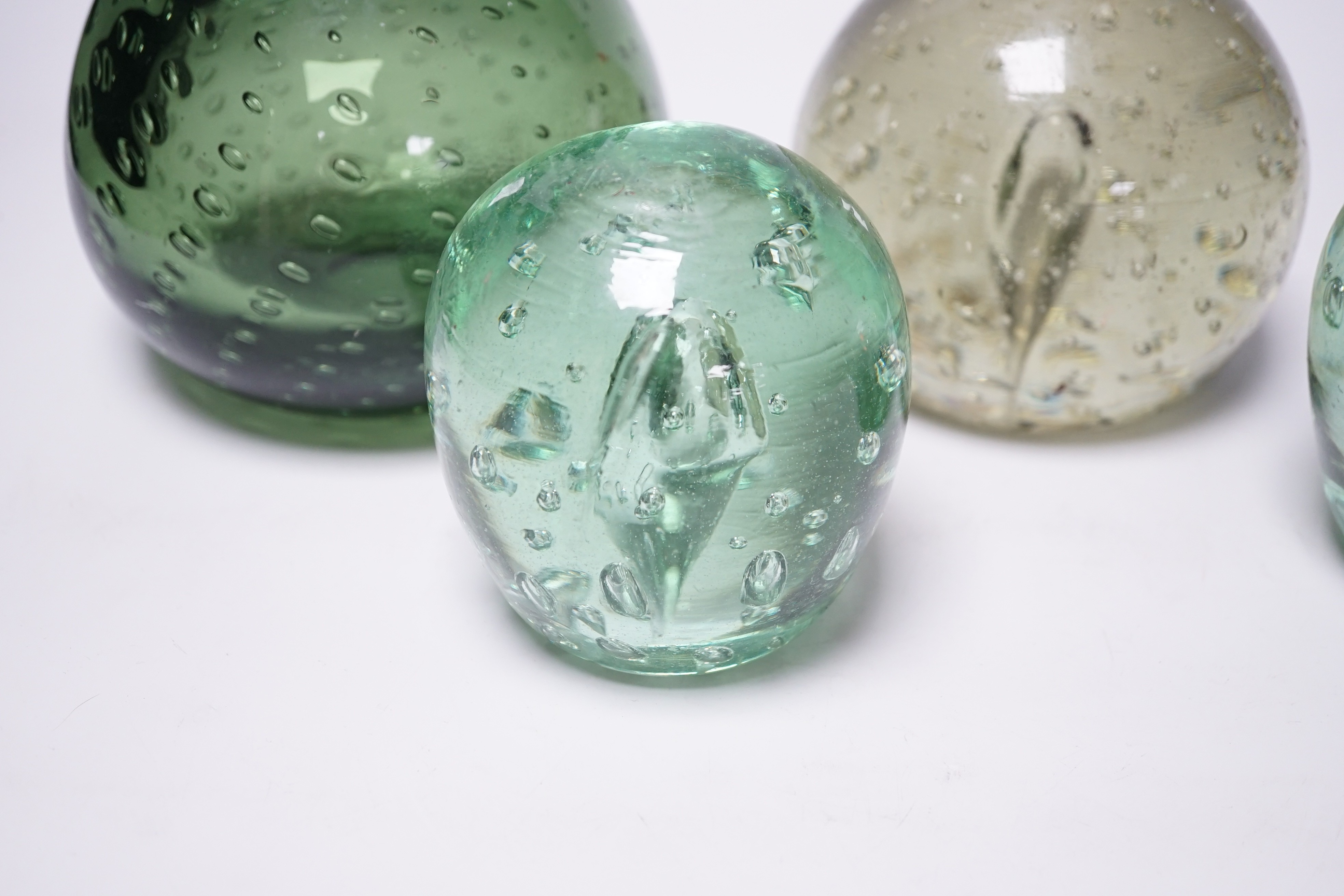 Four Victorian green glass dumps, tallest 16cm